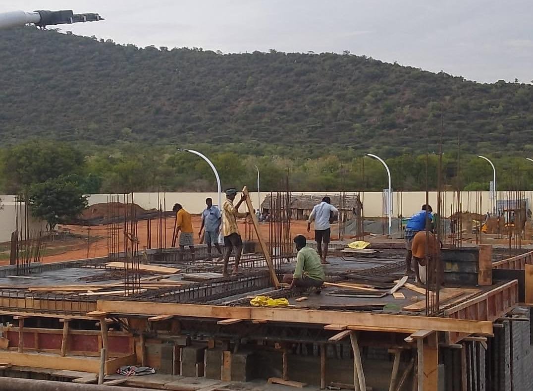 Workers preparing the slab before concreting
